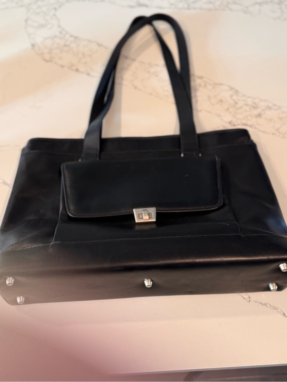 Structured Black Leather Tote with Front Pocket and Silver Hardware